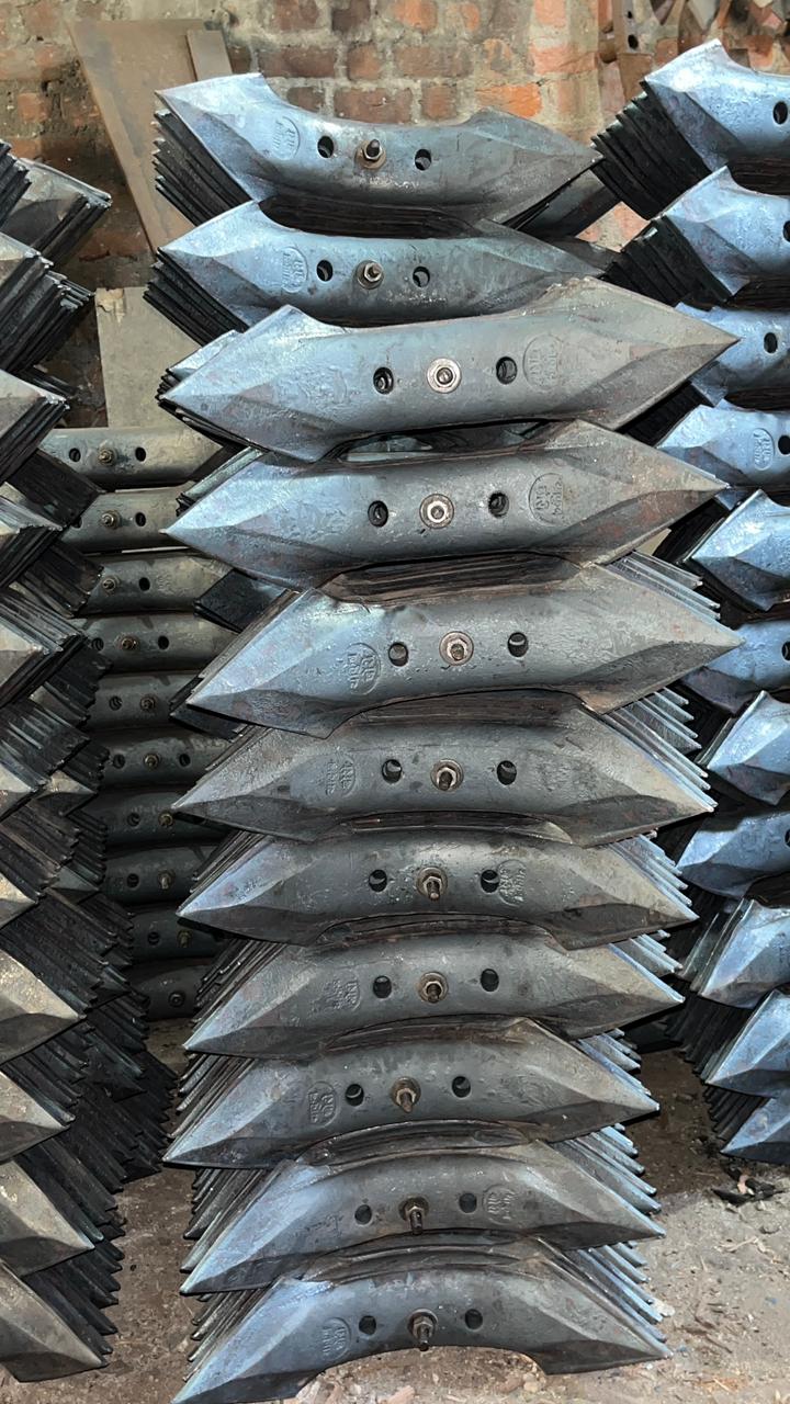 Nizami Agro cultivator shovels stacked in rows